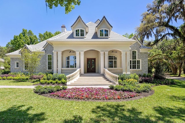 view of front of home with a front lawn and a porch