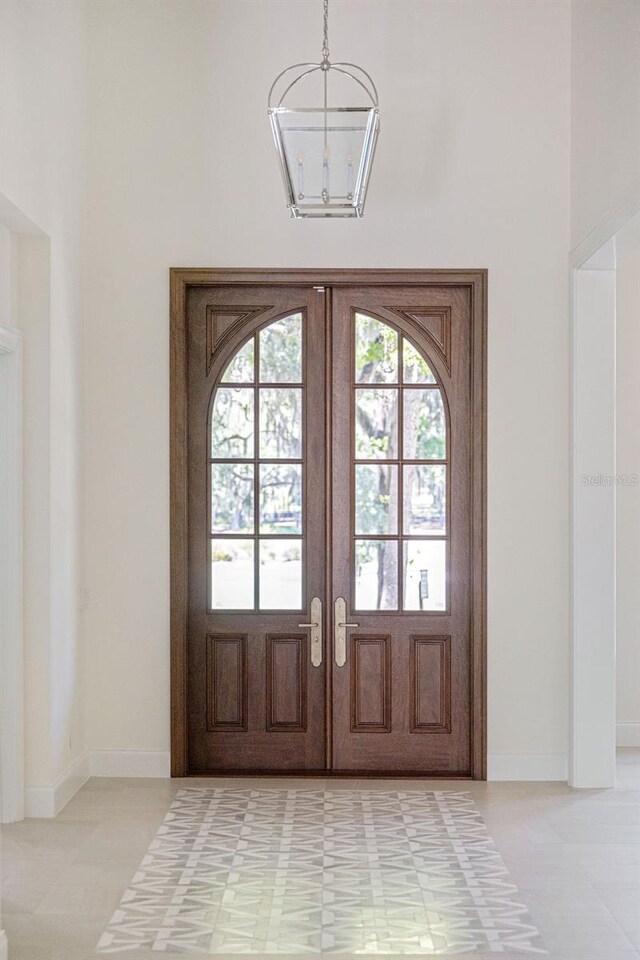 foyer with french doors and tile floors