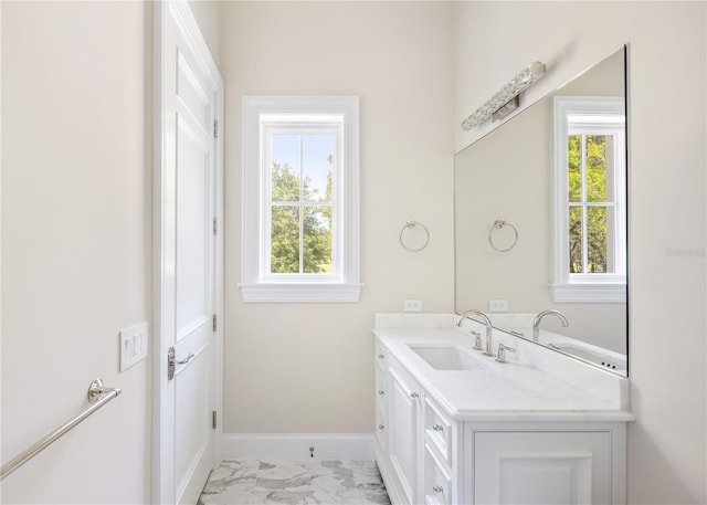 bathroom with plenty of natural light, vanity, and tile flooring