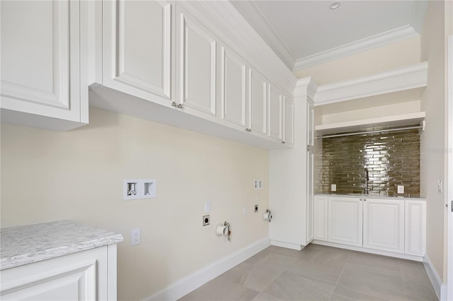 clothes washing area featuring hookup for an electric dryer, hookup for a washing machine, crown molding, hookup for a gas dryer, and light tile floors