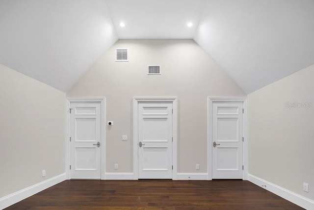 bonus room featuring lofted ceiling and dark wood-type flooring