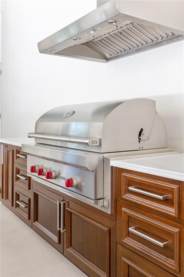 view of terrace featuring a grill and an outdoor kitchen