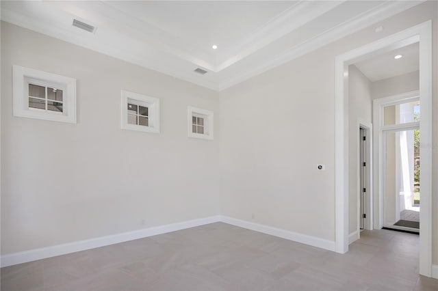 spare room featuring crown molding and tile floors