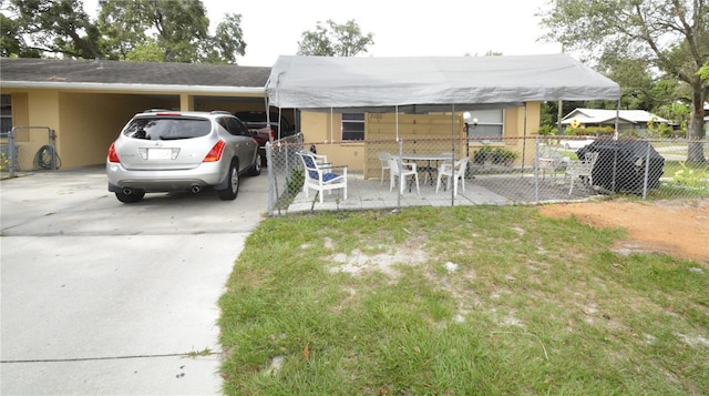 view of front of home featuring a carport