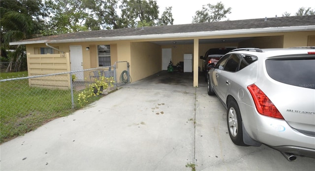 view of front facade with a front yard and a carport