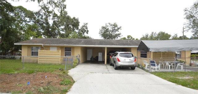 view of front of property featuring a carport