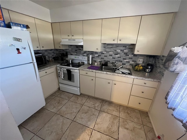 kitchen with white appliances, cream cabinets, tasteful backsplash, and sink