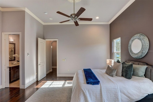 bedroom with dark wood-type flooring, sink, ensuite bathroom, crown molding, and ceiling fan