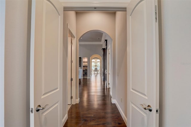 hallway with dark hardwood / wood-style flooring