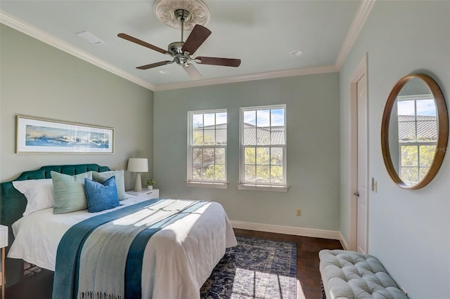 bedroom with ornamental molding, ceiling fan, and dark hardwood / wood-style flooring