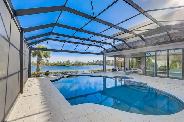 view of swimming pool with a water view, an in ground hot tub, a lanai, and a patio area