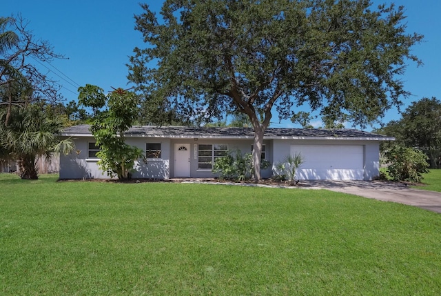 single story home with a garage and a front yard