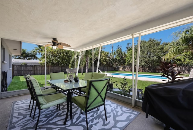 sunroom / solarium with ceiling fan