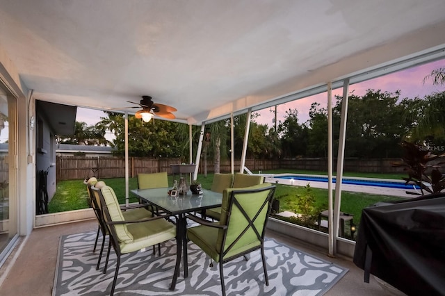 sunroom / solarium with ceiling fan