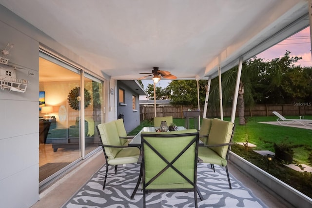 sunroom / solarium with ceiling fan