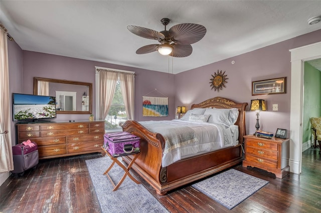 bedroom featuring dark hardwood / wood-style flooring and ceiling fan