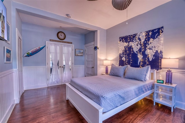 bedroom with ceiling fan and dark wood-type flooring