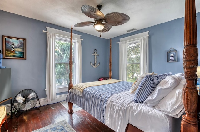 bedroom featuring ceiling fan and dark hardwood / wood-style floors