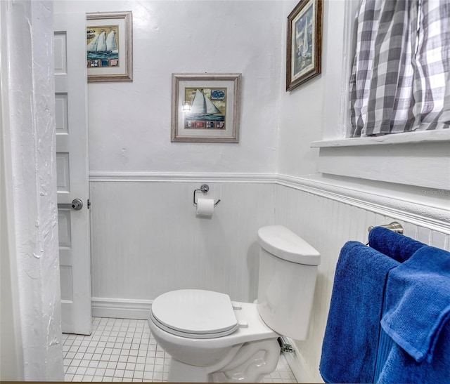 bathroom featuring tile patterned flooring and toilet