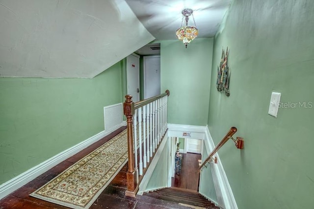 stairs with vaulted ceiling