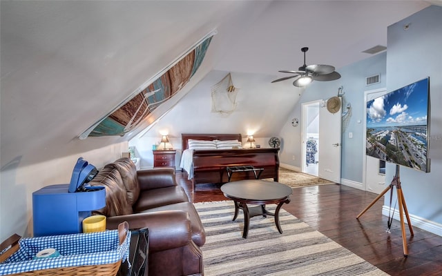 bedroom with vaulted ceiling, ceiling fan, and dark wood-type flooring