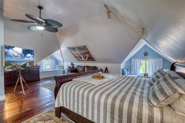 bedroom featuring dark hardwood / wood-style flooring, ceiling fan, and lofted ceiling