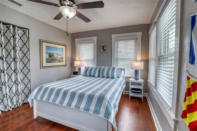 bedroom featuring ceiling fan and dark hardwood / wood-style flooring