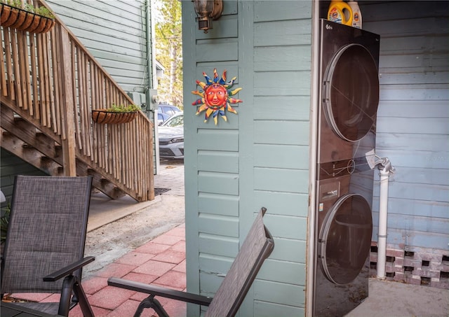 exterior space featuring stacked washing maching and dryer