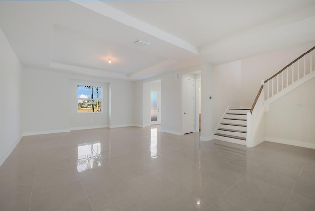 empty room with a tray ceiling