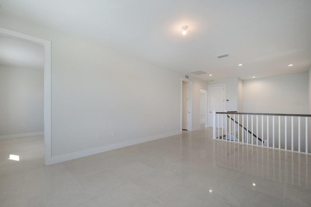 spare room with light tile patterned floors