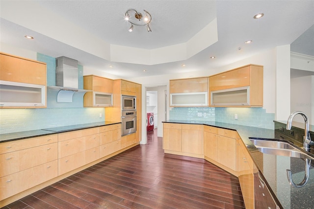 kitchen with appliances with stainless steel finishes, dark hardwood / wood-style floors, and light brown cabinets