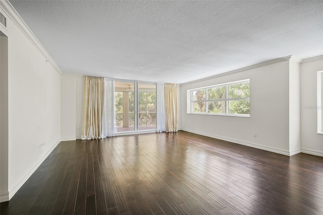 spare room with crown molding, dark hardwood / wood-style floors, and a textured ceiling