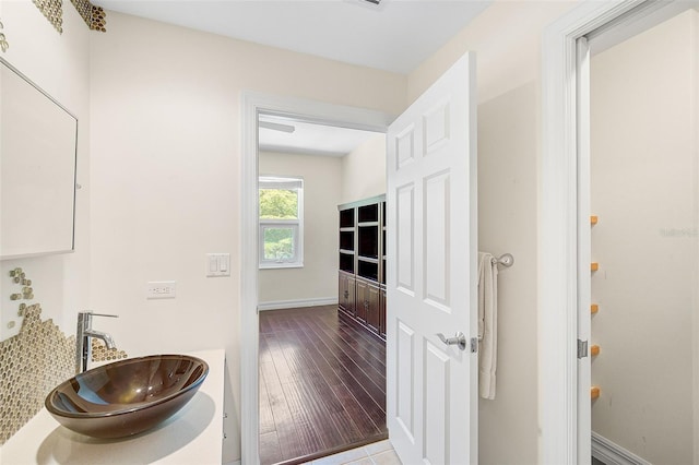 bathroom with hardwood / wood-style floors and sink