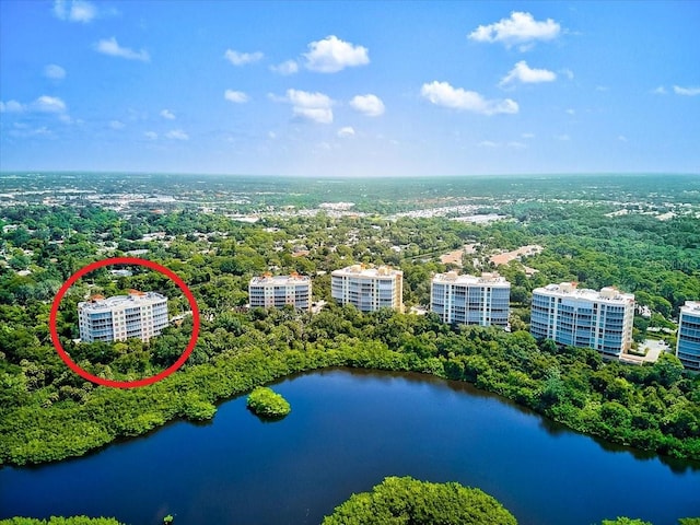 birds eye view of property with a water view