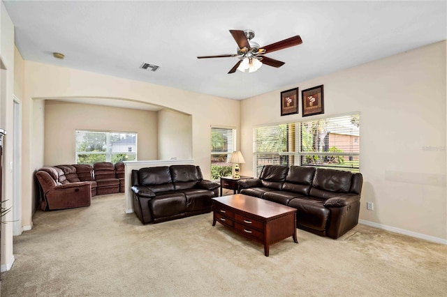 living room with light carpet and ceiling fan