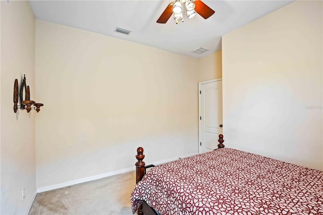 bedroom featuring light colored carpet and ceiling fan