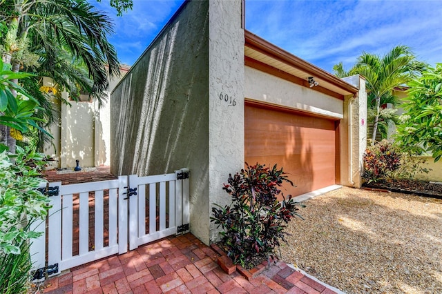 view of side of property featuring a garage