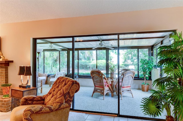 interior space featuring ceiling fan and a textured ceiling