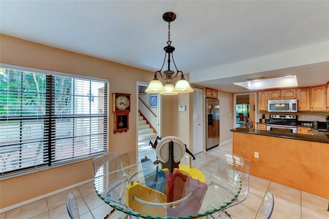 dining area featuring light tile patterned floors