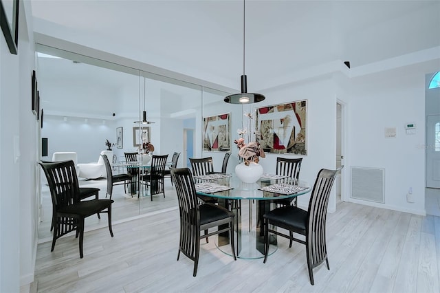 dining area with light hardwood / wood-style flooring