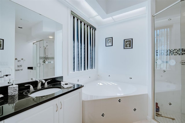 bathroom featuring plus walk in shower and large vanity