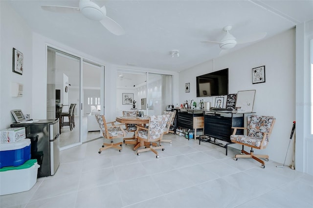 dining room featuring ceiling fan and light tile floors