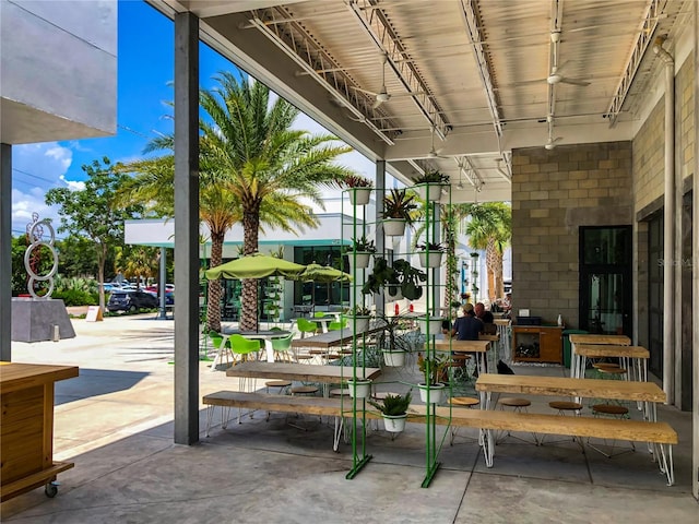 exterior space featuring ceiling fan