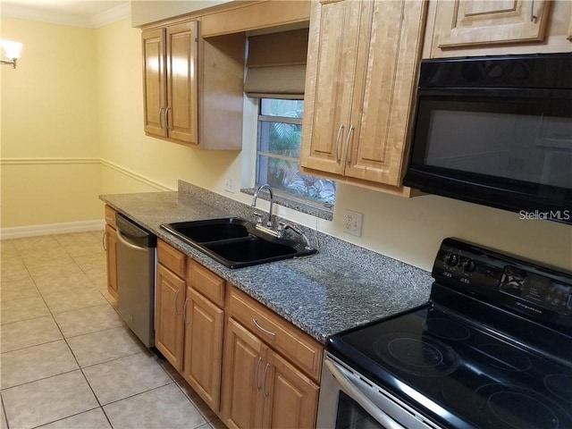 kitchen featuring sink, light tile floors, dark stone counters, ornamental molding, and appliances with stainless steel finishes