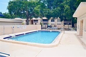 view of swimming pool with a patio