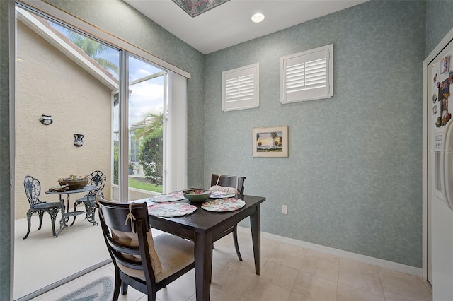 dining area with light tile flooring