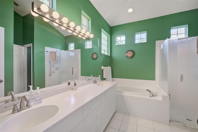 bathroom with plus walk in shower, vaulted ceiling, dual vanity, and tile flooring