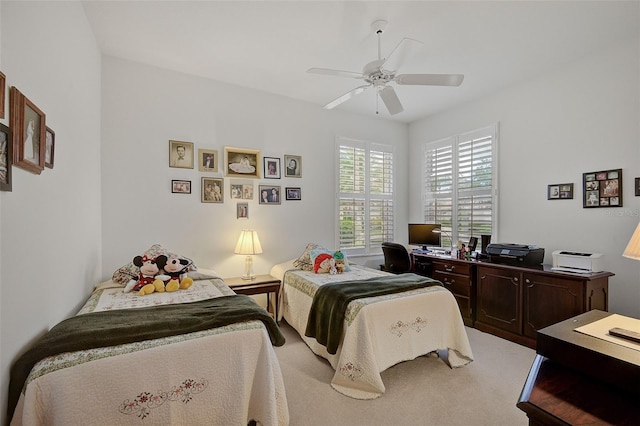 bedroom featuring light colored carpet and ceiling fan