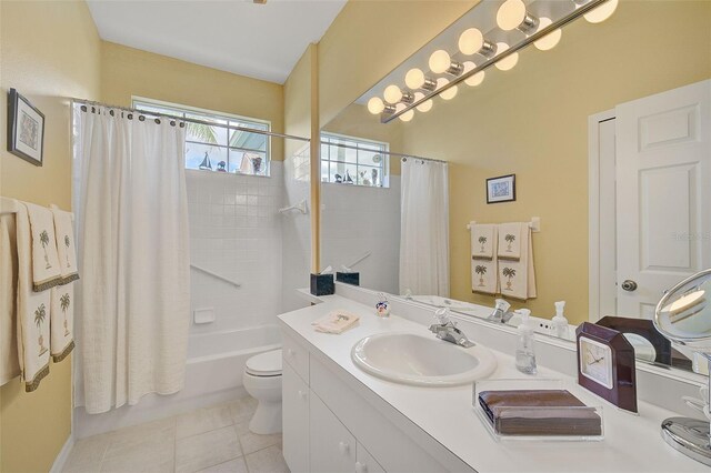 full bathroom with tile flooring, shower / tub combo with curtain, large vanity, and toilet