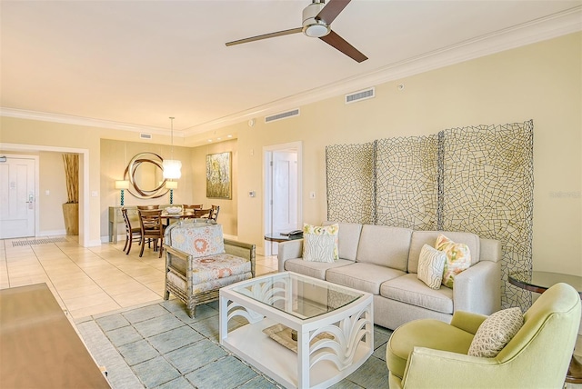 tiled living room with crown molding and ceiling fan